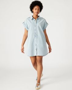 Stylishly versatile, the ILARA dress is perfect for any occasion. Made from durable denim, this women's shirtdress features a collared neckline, short sleeves, and button closure. Its mini length and flattering fit make it a must-have for any wardrobe. Short sleeve denim shift dress Two functional side pockets Length: 33" 100% cotton Hand wash Liv is 5ft 9in and is wearing a size small Trea is 5ft 10in and is wearing a size large Imported Short Sleeve Denim, Womens Denim Dress, Sweater Sale, Shirtdress, Denim Fabric, Wearing Dress, Vintage Tops, T Shirt Dress, Denim Dress