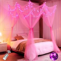 a bed with pink lights on it in a room