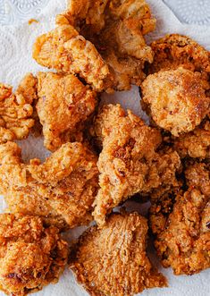 fried chicken pieces on a white paper towel