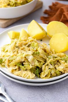 a white plate topped with pasta and potatoes