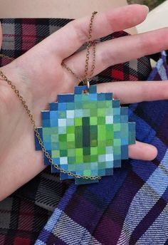 a person wearing a necklace made out of squares