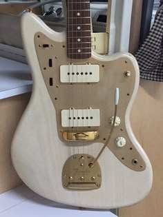 an electric guitar sitting on top of a counter