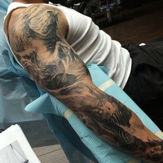 a man with a tattoo on his arm