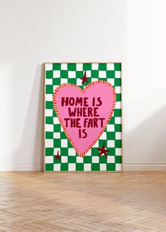 a pink heart with the words home is where the fart is