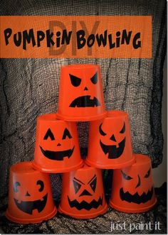 pumpkin bowling cups are stacked up in the shape of jack - o'- lanterns