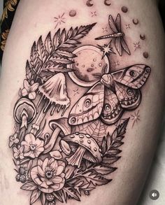 a woman's thigh with tattoos on it