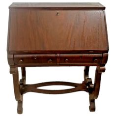 an old wooden desk with two drawers on the top and one drawer at the bottom