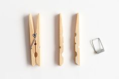 three pieces of wood are being used to make a pair of scissor holders