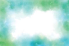 a blurry image of the sky and clouds is shown in green, blue, and white