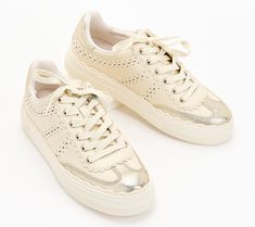 This casual chic leather sneaker adds panache to loungewear on laidback days. Plus, the neutral color combo and platform sole elevate the look. From Vince Camuto. Beige Leather Platform Sneakers With Vulcanized Sole, Chic Leather Sneakers With Laces, Trendy Cream Sneakers With Perforated Toe Box, Chic Sneakers With Perforated Toe Box, Trendy Beige Sneakers With Perforated Toe Box, Chic Low-top Sneakers With Rubber Sole, Chic Beige Sneakers With Round Toe, Chic Lace-up Sneakers With Contrast Sole, Chic Low-top Sneakers For Spring