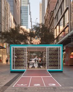 an empty basketball court in the middle of a city