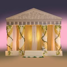 an image of a stage set up with curtains and flowers on the stage for a wedding ceremony