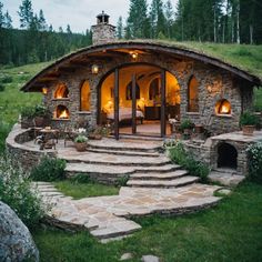 an outdoor living area with stone steps leading up to it