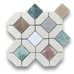 a white and green mosaic tile with different colored tiles on it's sides, all arranged in the same hexagonal pattern