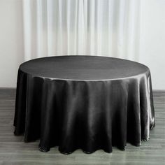 a round table with black cloth on it