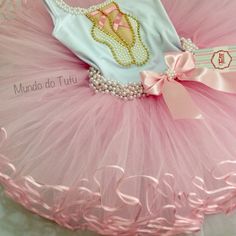 there is a pink tutu with pearls on it