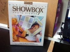 a box with a photo on it sitting next to a teddy bear