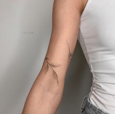 a woman with a tattoo on her arm