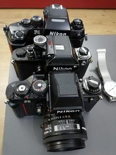 many different cameras sitting on top of each other