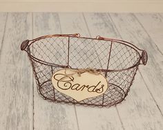 a wire basket with a sign that says cards on it