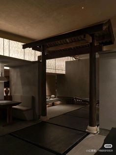 the interior of a japanese style house with wood and stone accents on the walls, floor, and ceiling