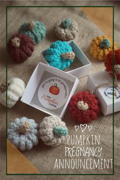 there are crocheted pumpkins and boxes on the table