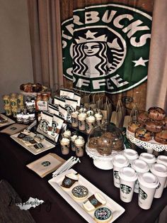 a table topped with starbucks cups and desserts