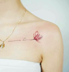 a woman's chest with a pink flower and the words love written on it