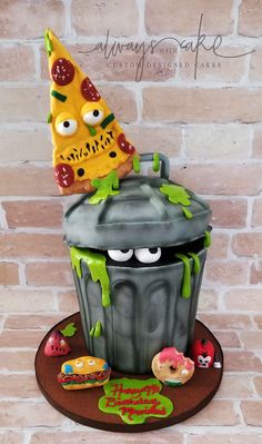 a cake made to look like a trash can