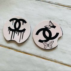 two badges with the word chanel painted on them