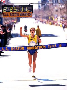 a marathon runner crosses the finish line