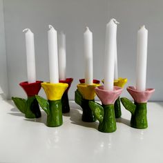 several candles are lined up in the shape of flowers