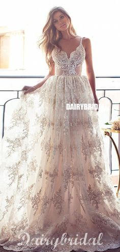 a woman in a wedding dress standing on a balcony