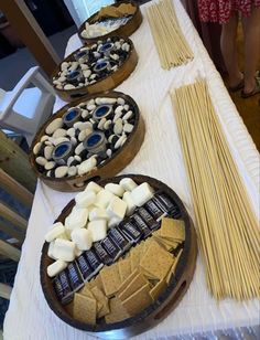 three bowls filled with different types of snacks