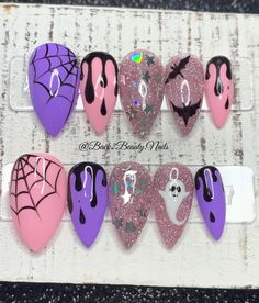 Pink and Purple Halloween Nails/ Handmade Reusable Press on Nails/ Cute and Spooky Nails Model: Short stiletto Please read full description below. This set features:  Thumb - pink or purple background with handpainted spider web Index, pinky - pink or purple background with handpainted black drip design Middle - reflective fine pink glitter background with holographic glitter accents Ring - reflective fine pink glitter background with ghost or bat design Glossy finish Gel polish. I offer quality handcrafted press on nails designed with quality gel polish. This set will give you a perfect manicure within a few minutes for a small portion of the salon cost.  Sets come with 10 nails (based on the size/shape selected), nail prep kit, and instructions. Reusable if removed correctly. 100% natura Cutest Halloween Nails, Horror Stilleto Nails, Pink Goth Nails Short, Halloween Fairy Nails, Goth Disney Nails, Pastel Witch Nails, Teal Halloween Nails, Pink And Purple Halloween Nails, Birthday Disney Nails