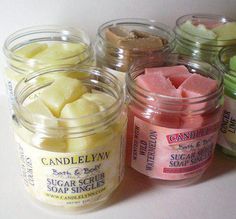 several jars filled with different types of sugar