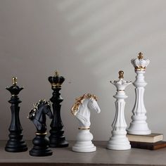 chess pieces are lined up on a table