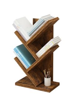 a wooden book shelf with books and pens in it on top of a white background