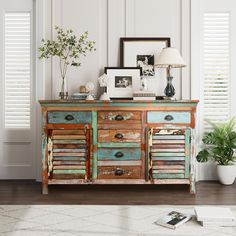 an old dresser has been painted blue and brown