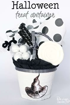 a halloween treat container filled with candies and marshmallows for the trick or treat