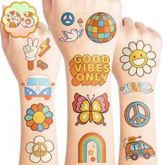 three different temporary tattoos on the arms of someone's hands with peace, flowers, and symbols