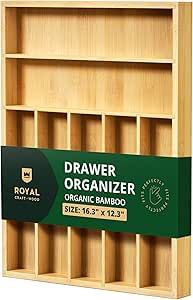 a wooden shelf with drawers and labels on the bottom shelves for organization, made out of natural wood