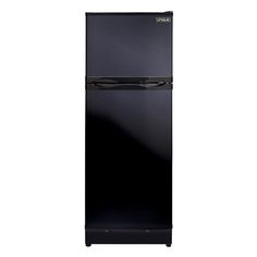 a black refrigerator freezer sitting on top of a white wall