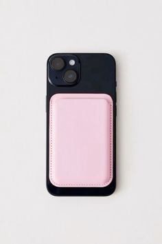 an iphone case with a pink card holder on it's back cover, against a white background