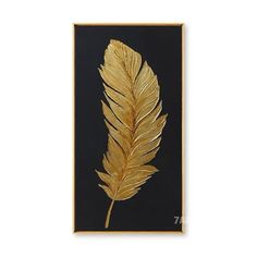 a gold leaf on a black background