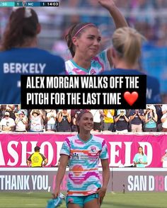 a woman walking on top of a field with a soccer ball in her hand and the words alex morgan walks off the pitch for the last time