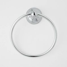 a chrome towel ring on a white surface with the handle extended to it's side