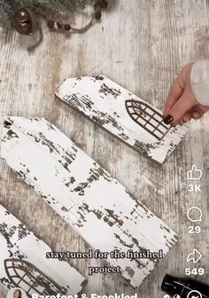 two pieces of white painted wood sitting on top of a wooden floor