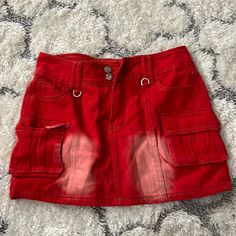 Red Jean Skirt. Size Large But Runs Small So Like A Medium. New With Tags. Red Fitted Y2k Bottoms, Red Skirt With Pockets For Spring, Red Spring Skirt With Pockets, Red Casual Mini Skort, Casual Red Mini Skort, Red Casual Mini Length Skort, Red Y2k Style Summer Bottoms, Red Y2k Summer Bottoms, High Waist Red Mini Skirt With Pockets