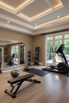 a home gym with exercise equipment and mirrors